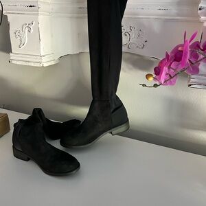 These are knee-high black boots with a half inch heel.  These are brand new